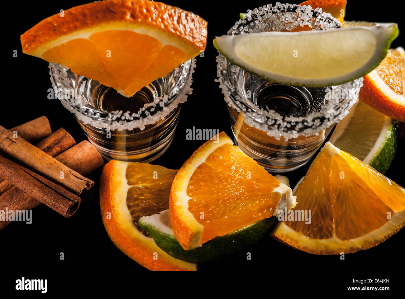 Gold and silver tequila with lime or lemon and orange Stock Photo Alamy