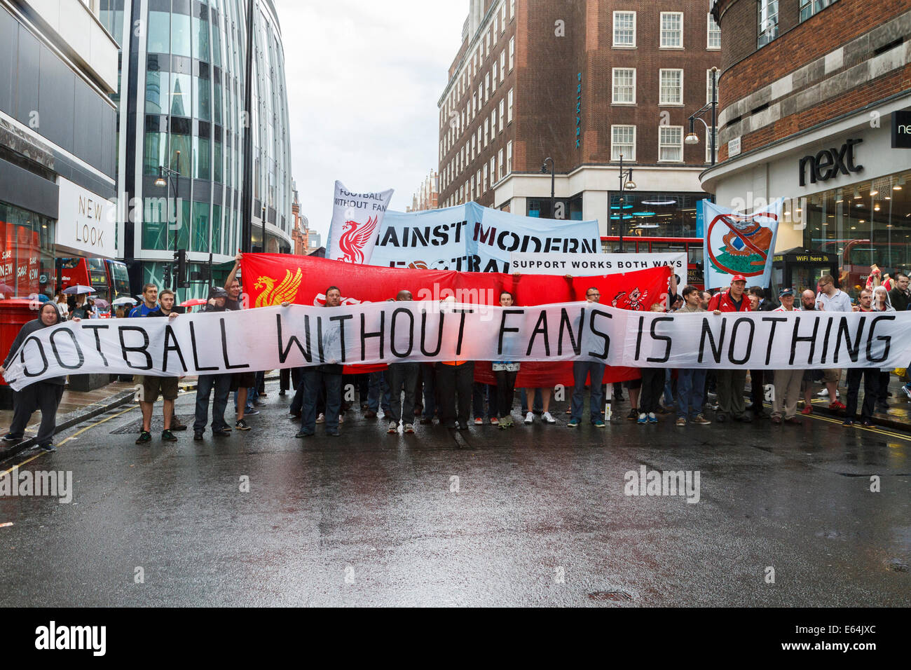 Football supporters march on the Premier League and Football League headquarters to demonstrate over the rising cost of tickets for matches, London, UK Stock Photo