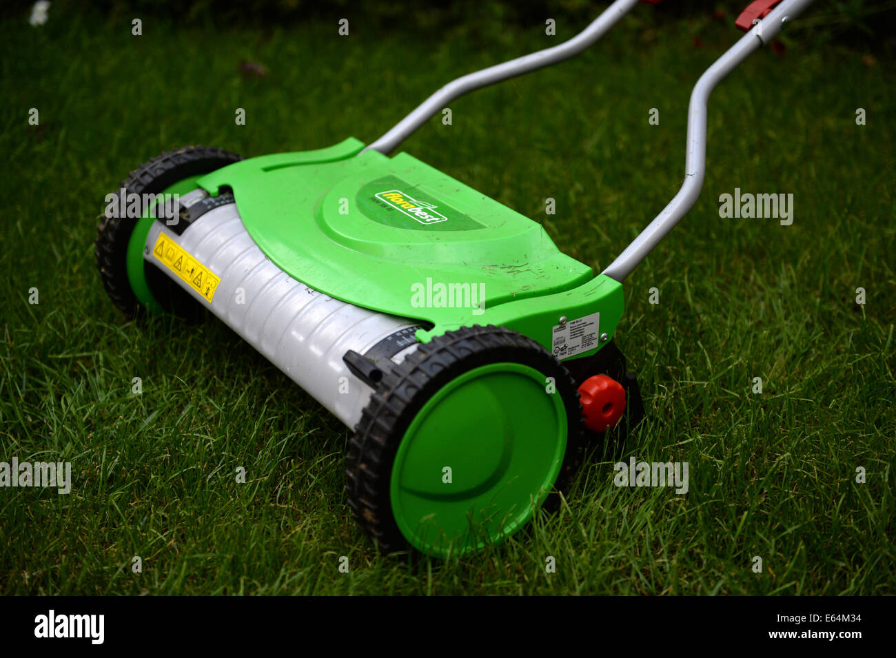 Grass cutting with a hand mower Stock Photo