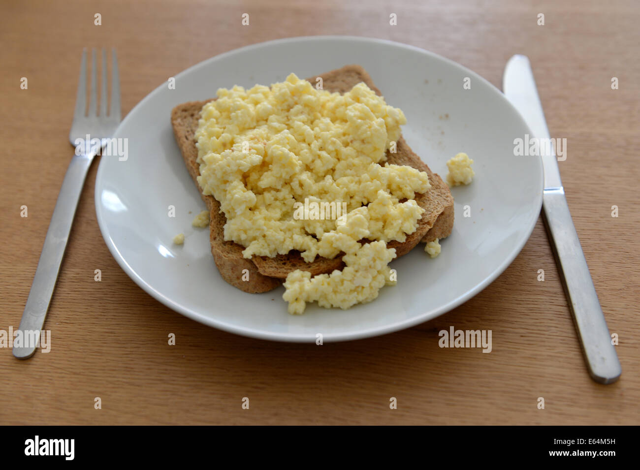 Scrambled eggs on toast Stock Photo