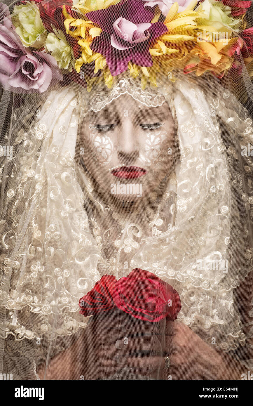 https://c8.alamy.com/comp/E64MNJ/mysterious-woman-with-flowers-behind-veil-E64MNJ.jpg