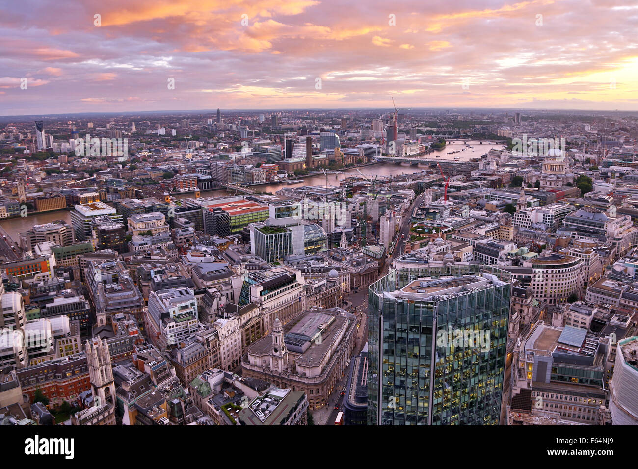 General view of buildings of the city skyline at dusk in London, England Stock Photo