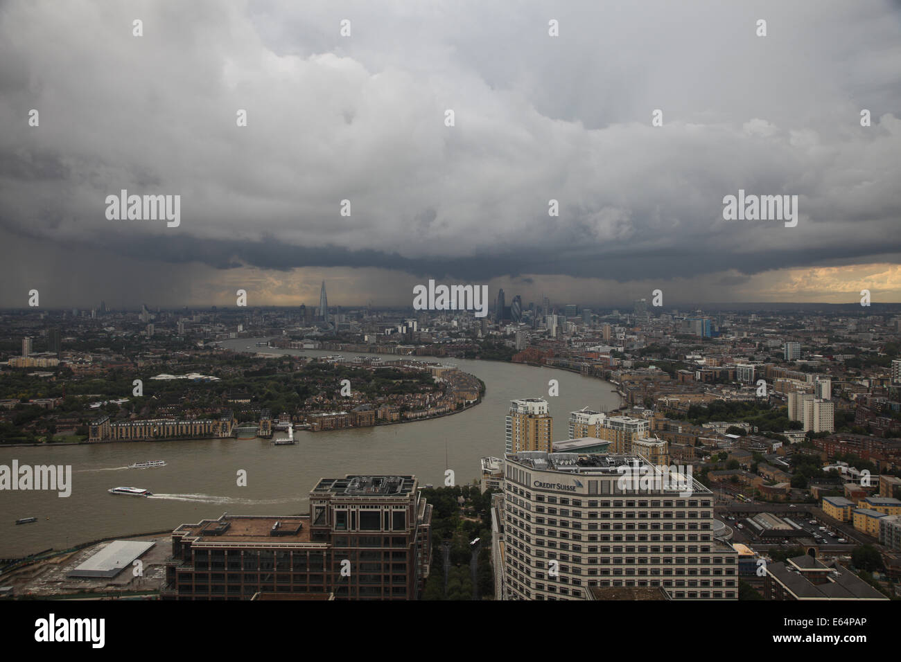 LONDON UK, 14th August 2014. A heavy rainstorm passes over London at the start of the evening rush hour. This photo taken from Canary Wharf in London's Docklands financial district Credit:  Steve Bright/Alamy Live News Stock Photo