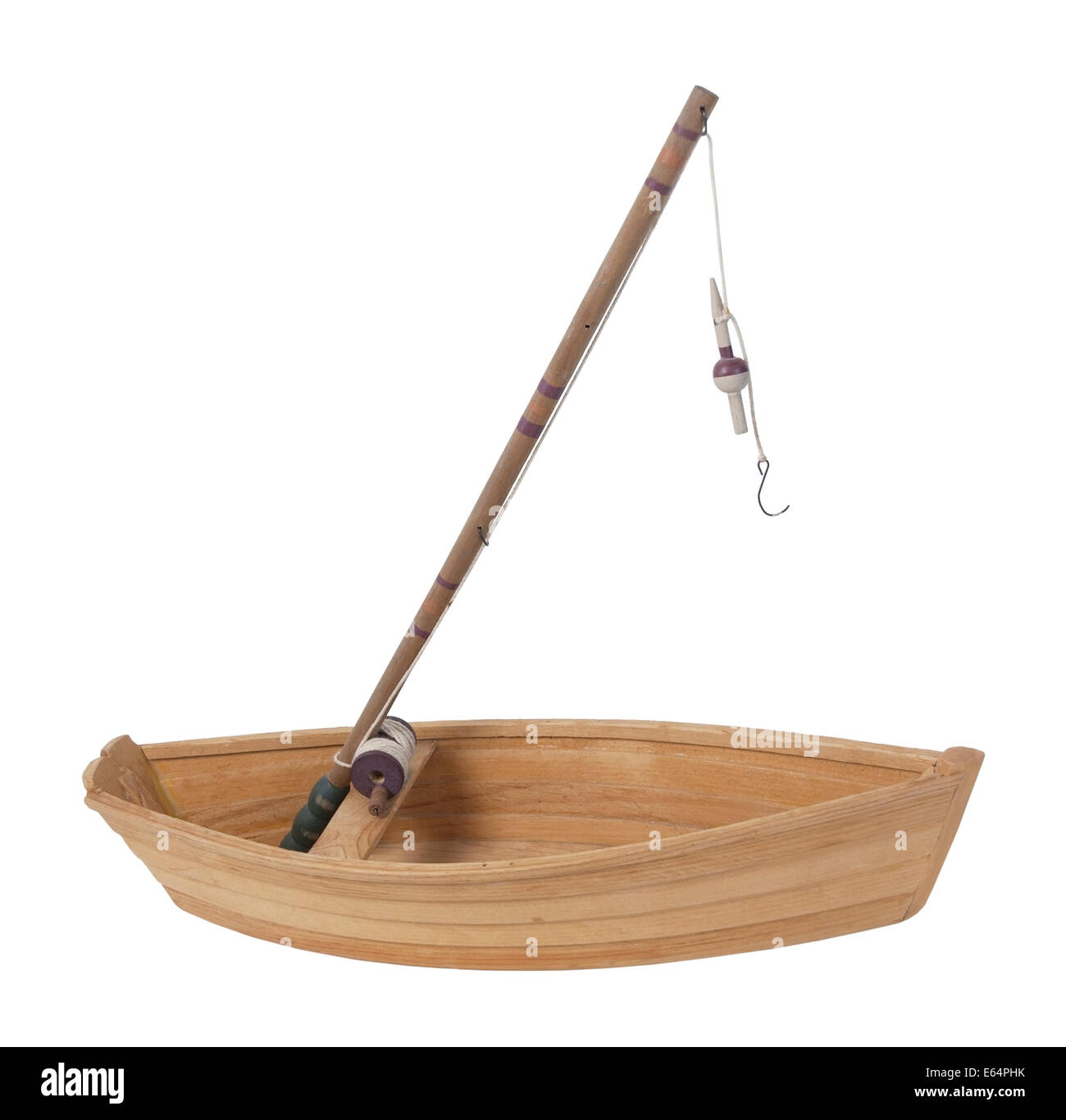 Fishing pole with rod and reel used to catch fish sitting in a wooden boat  - path included Stock Photo - Alamy