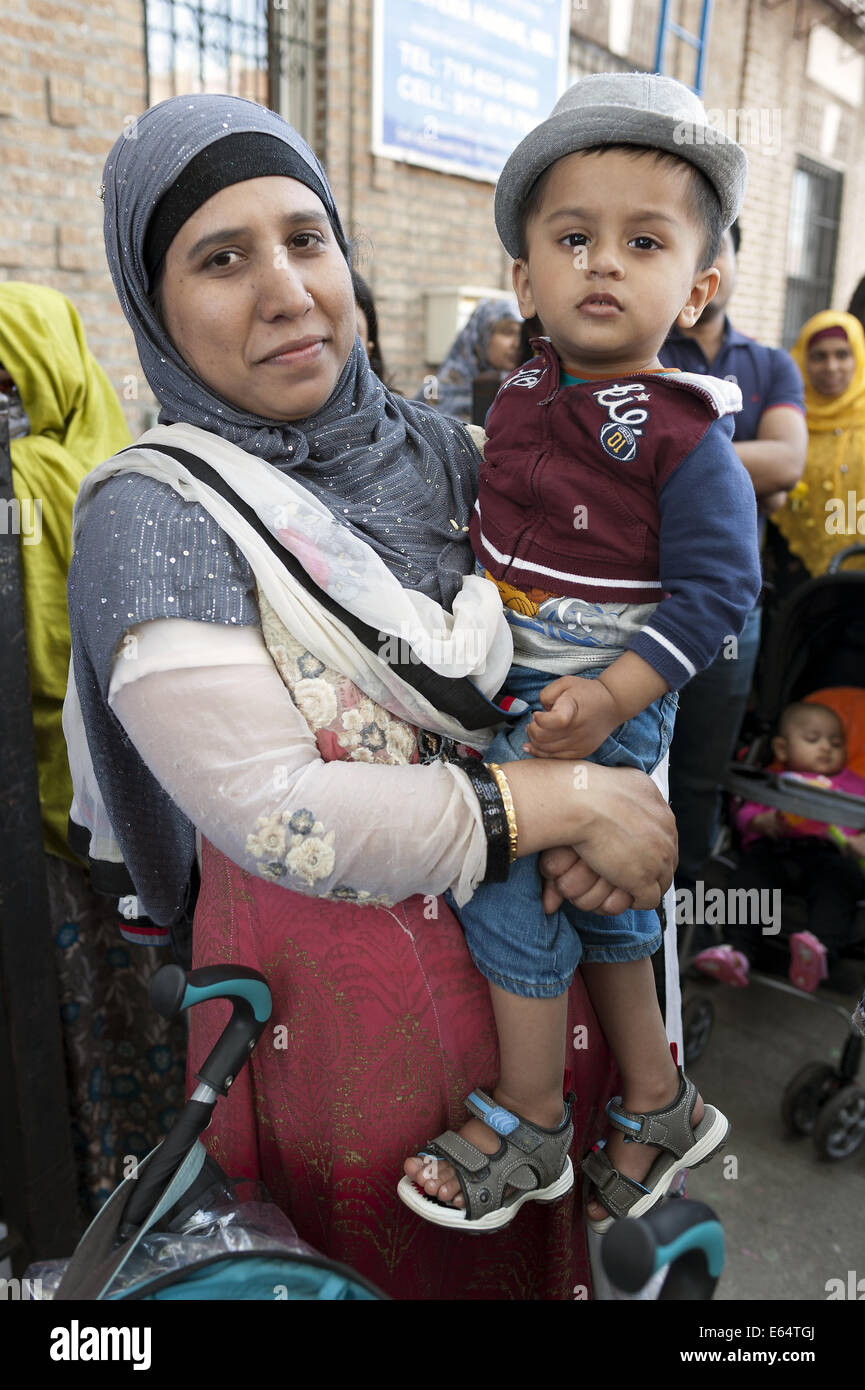 Mother and child at Bangladeshi street fair in Brooklyn in New York