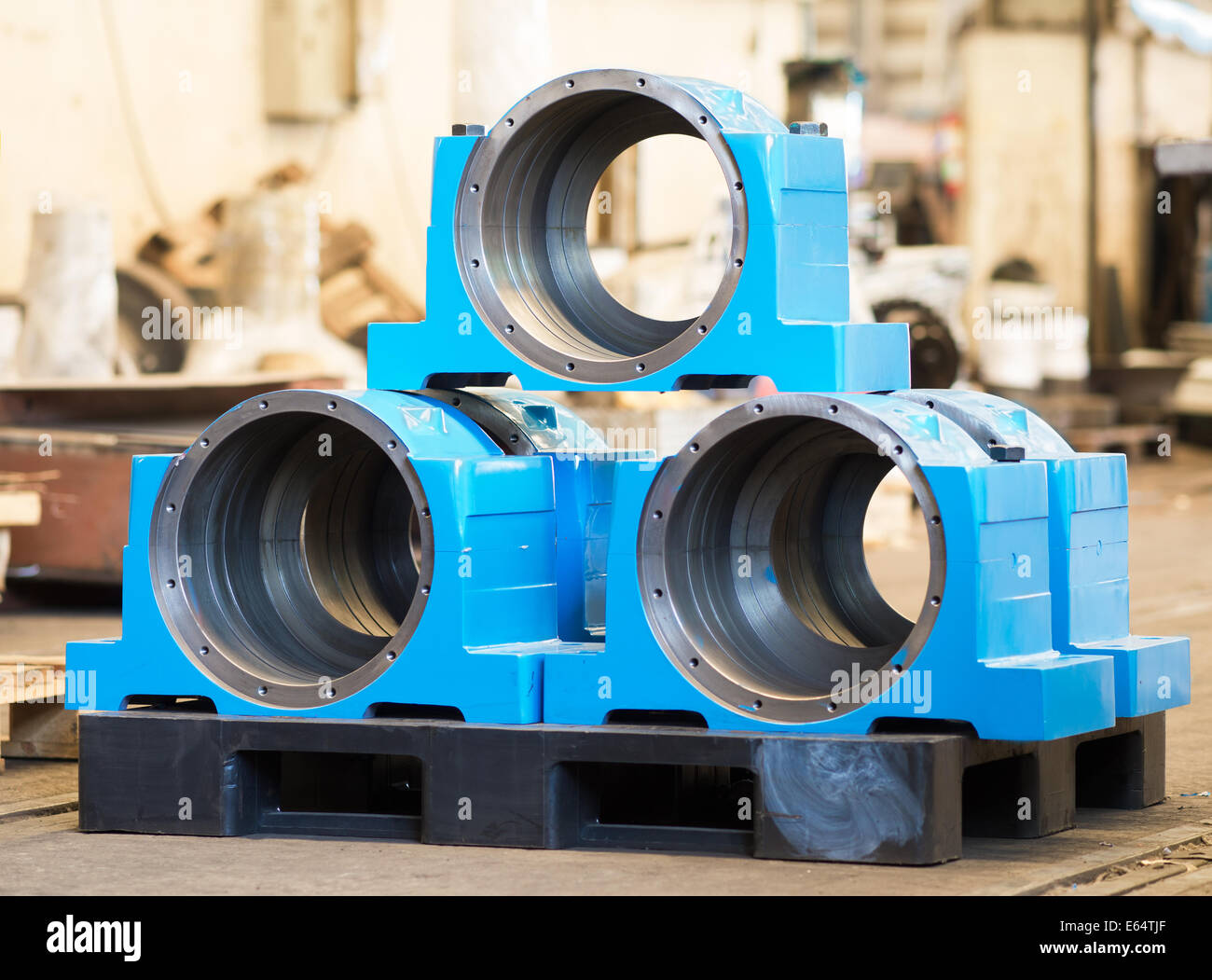 Bearing housings on pallet in an industrial environment. Shallow depth of field. Stock Photo