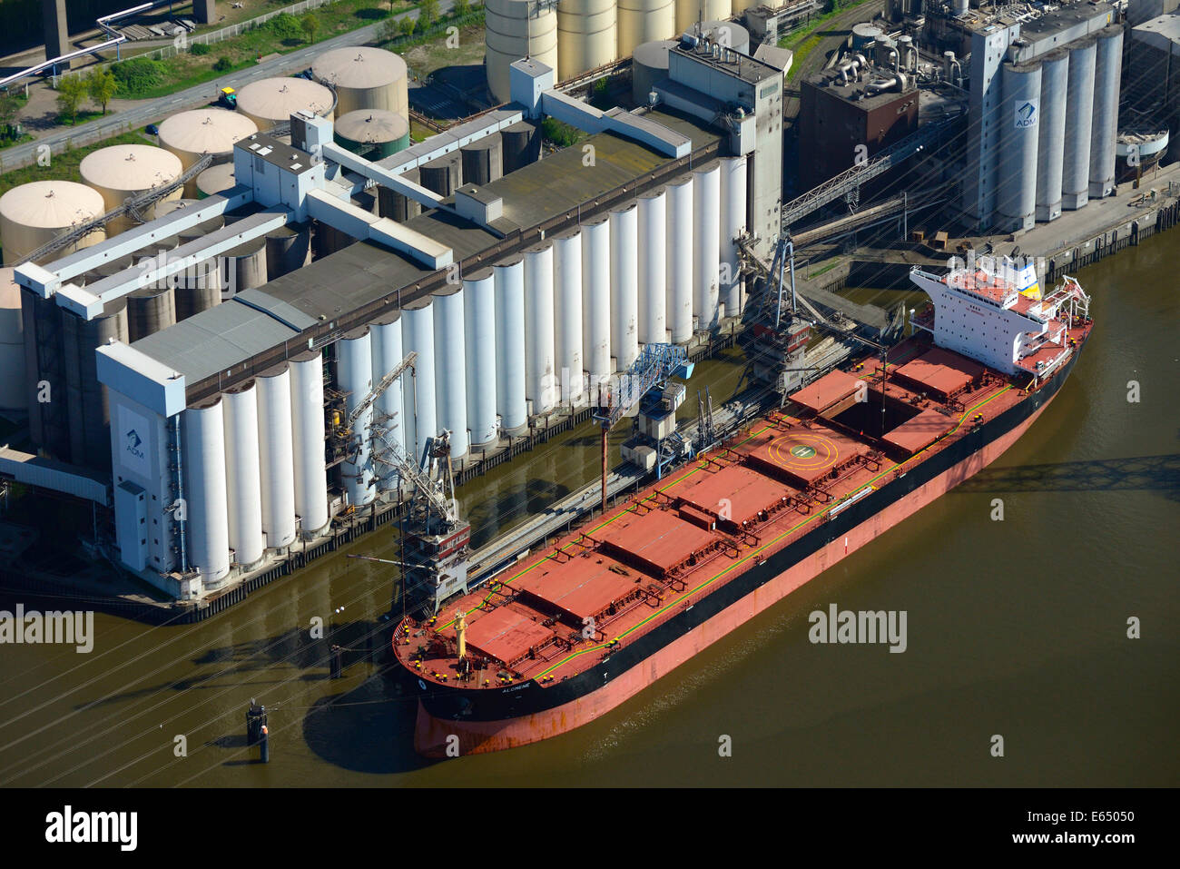 Aerial view, Al Cmene, cargo ship, in front of the ADM oil mill and silo, Hamburg, Germany Stock Photo