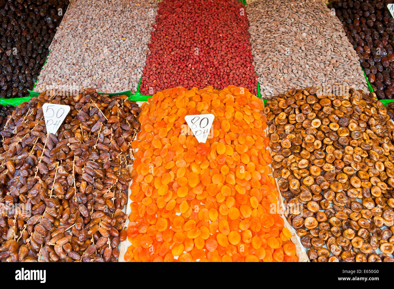 Dried apricots, dates, figs and nuts, on sale at a market stall in Djemaa el Fna square, Marrakech, Morocco Stock Photo