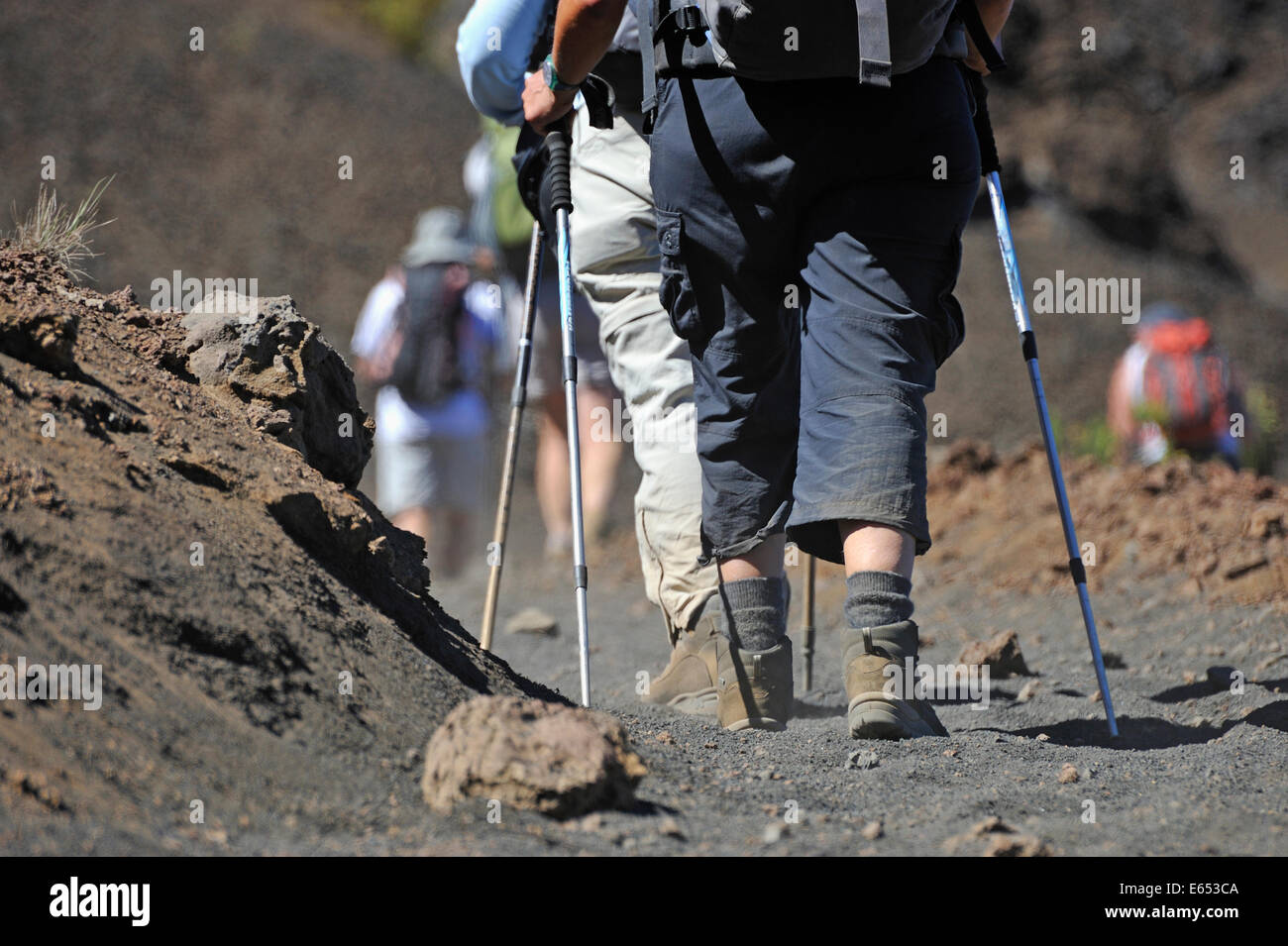 People walking and hiking on volcano trail in the Haleakala crater, Maui Island, Hawaii Islands, USA Stock Photo