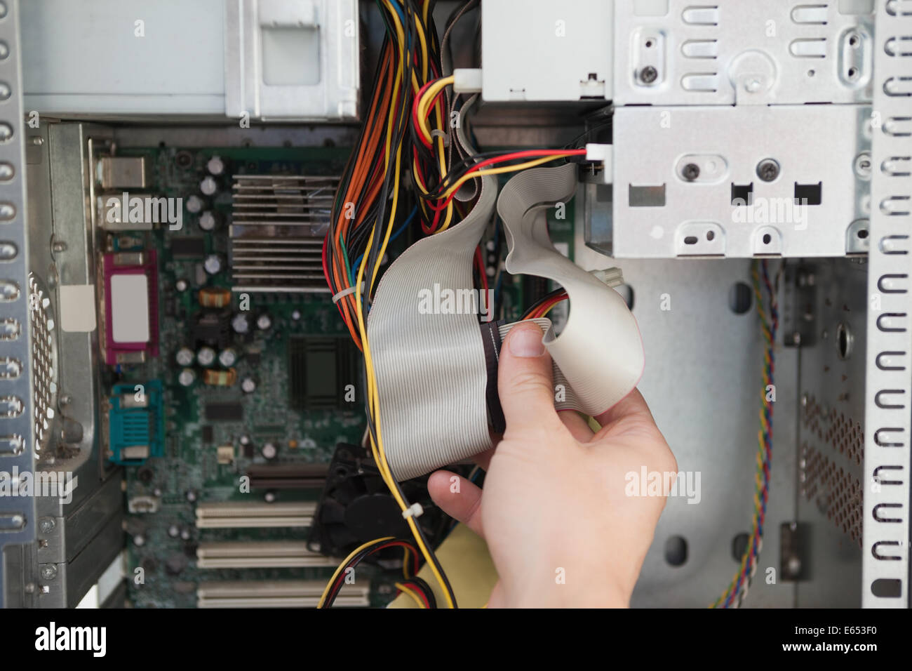 Computer engineer working on broken console Stock Photo - Alamy