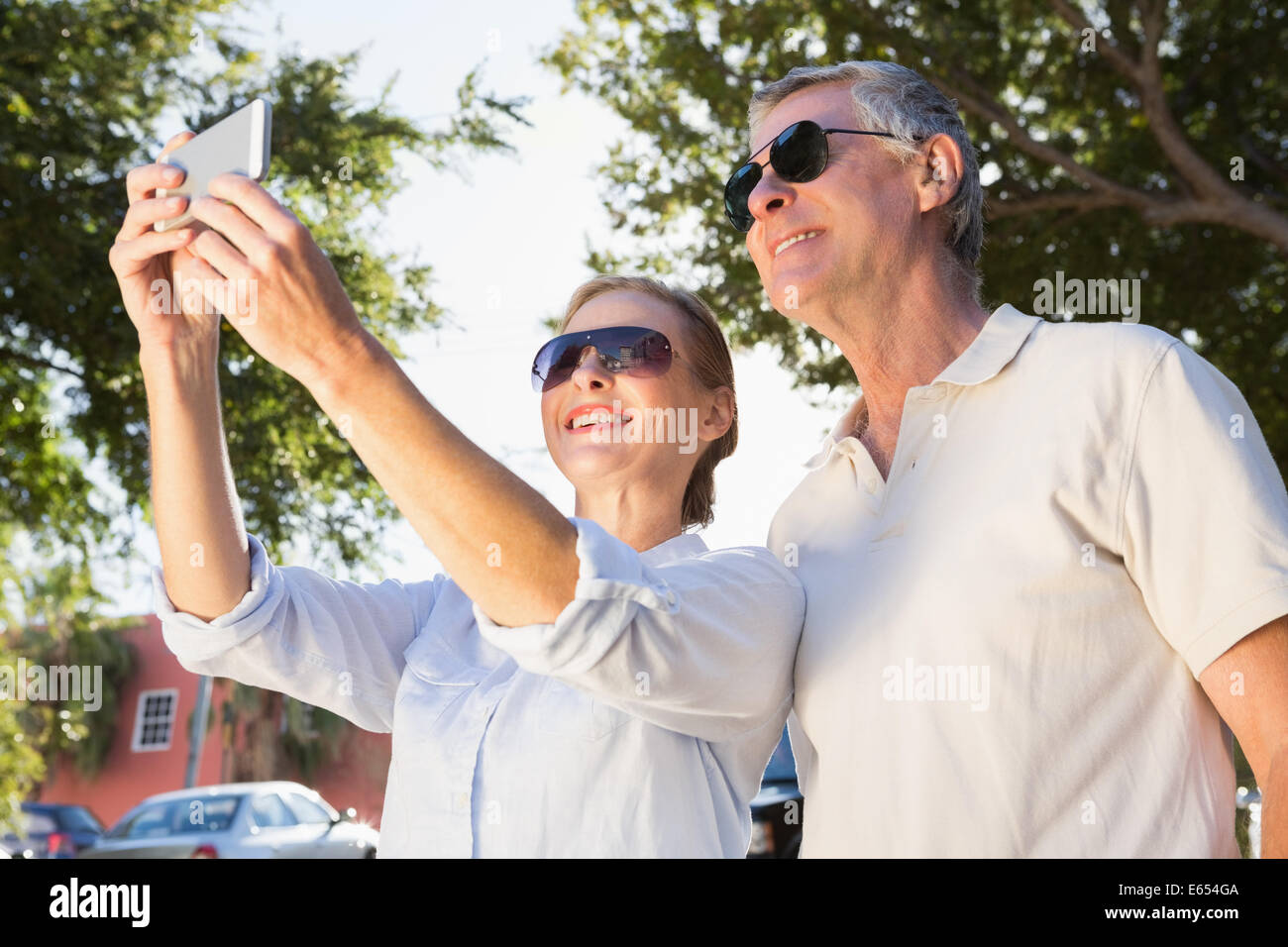 Happy senior couple posing for a selfie Stock Photo - Alamy