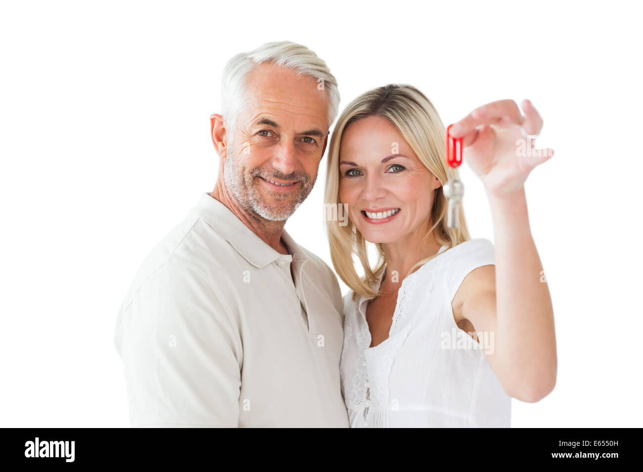 Happy couple showing their new house key Stock Photo - Alamy