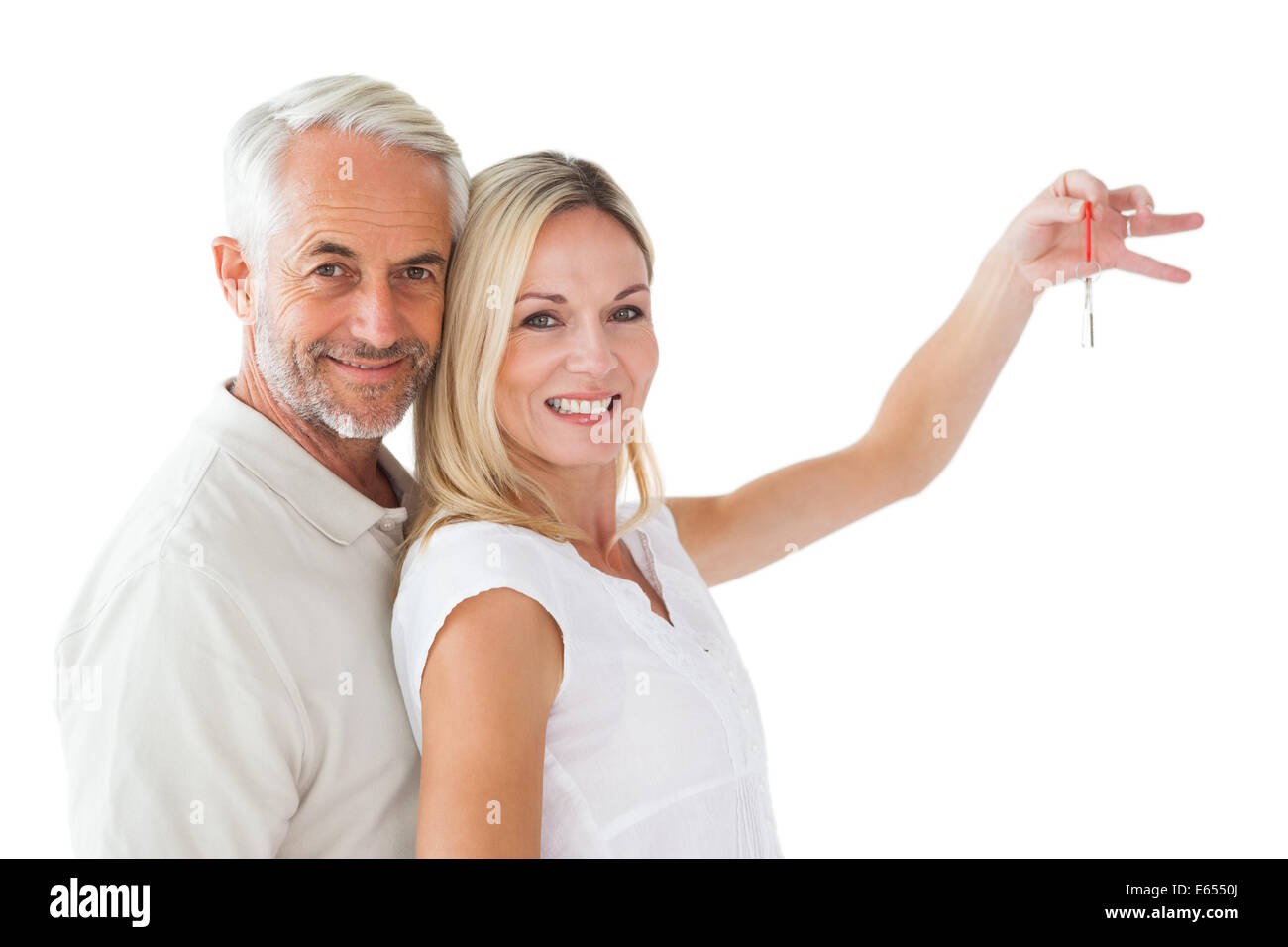 Happy couple showing their new house key Stock Photo - Alamy