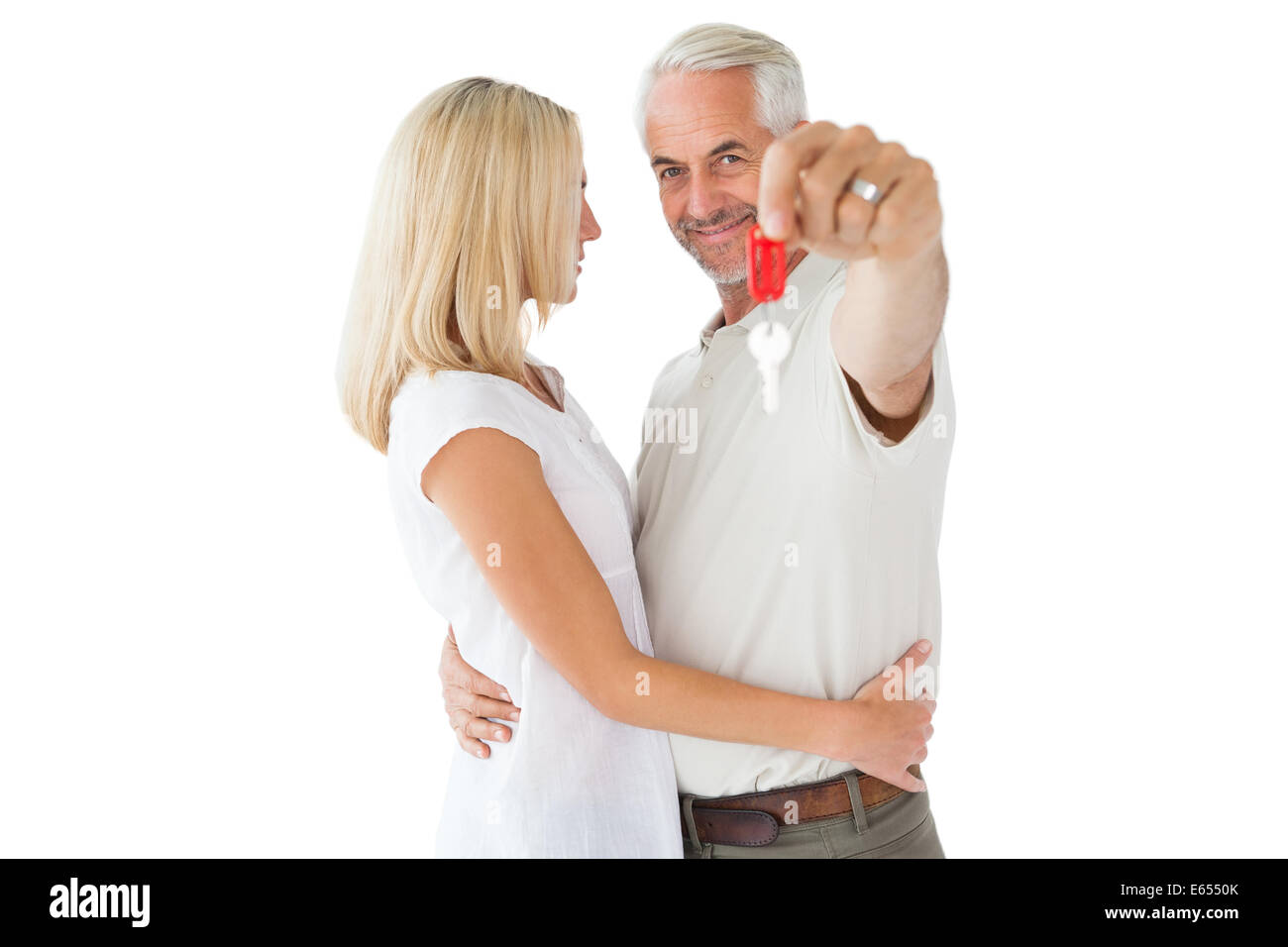 Happy couple showing their new house key Stock Photo - Alamy