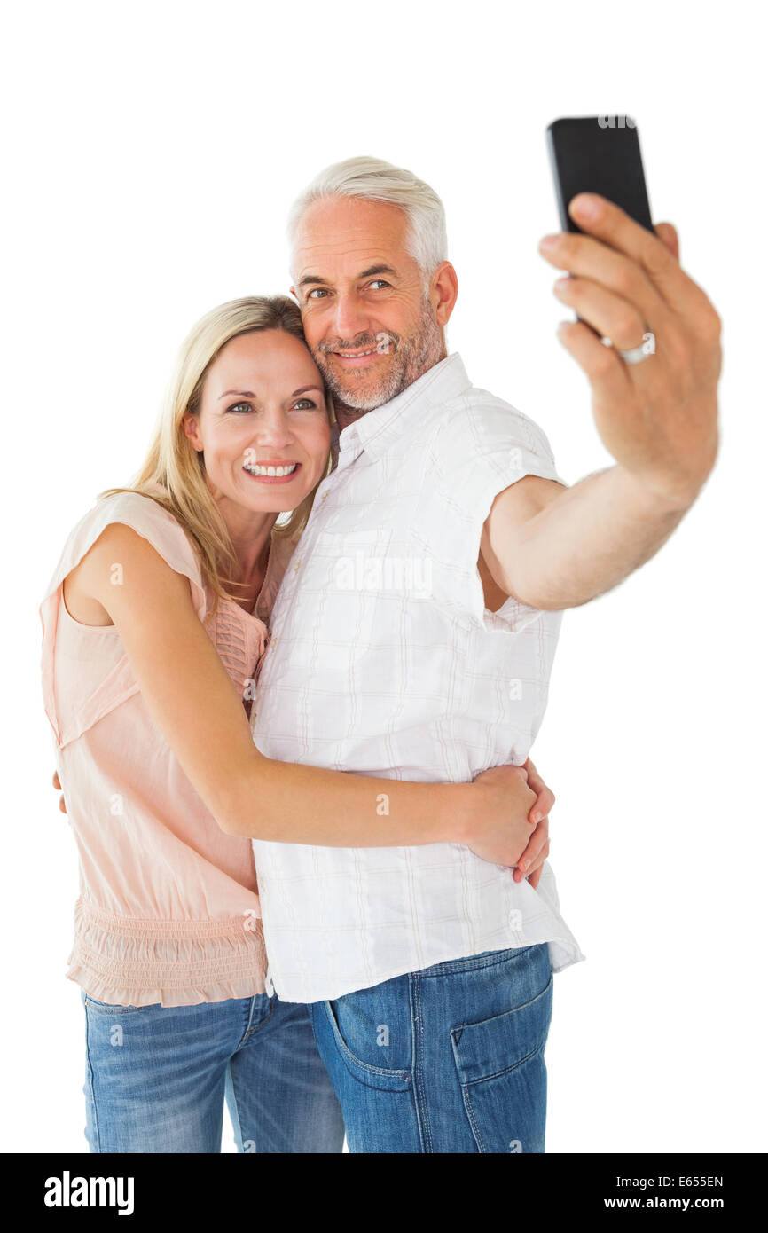Happy couple posing for a selfie Stock Photo - Alamy