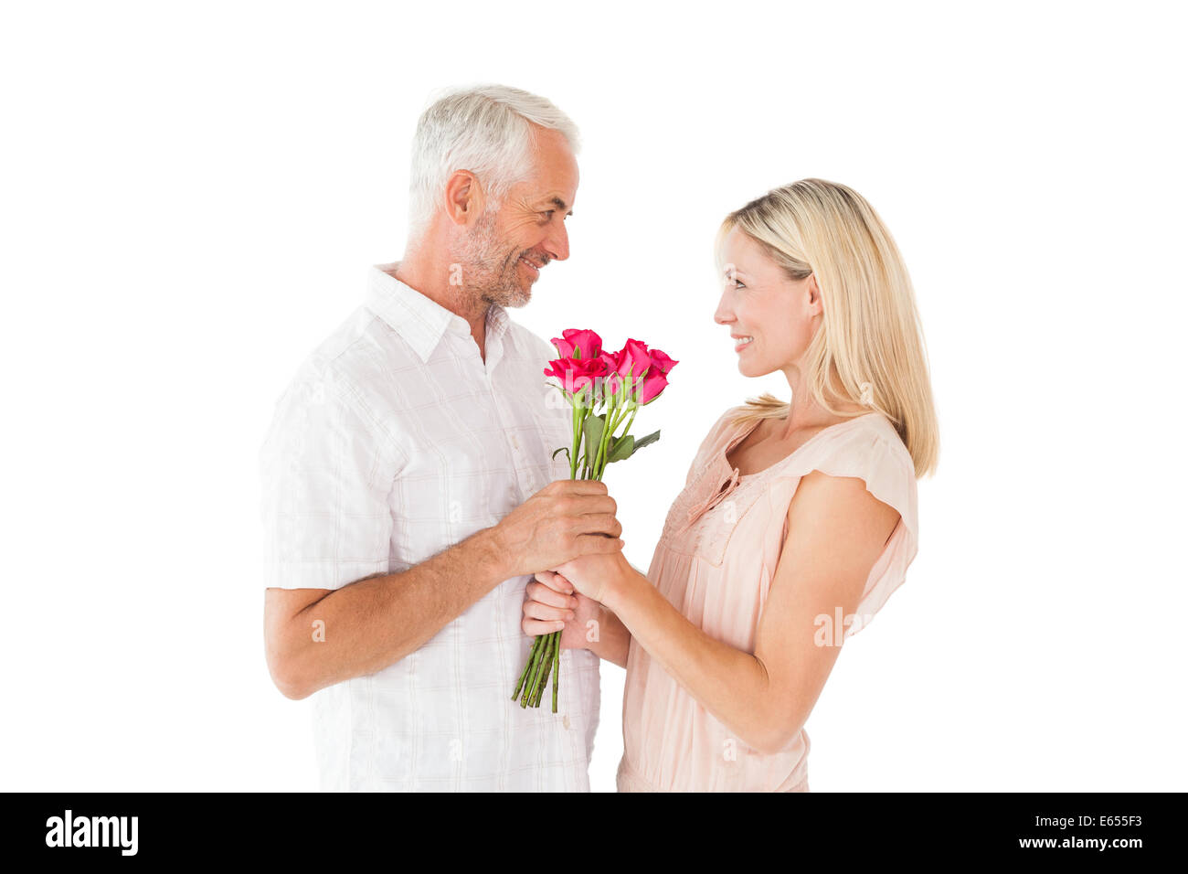 Affectionate man offering his partner roses Stock Photo - Alamy