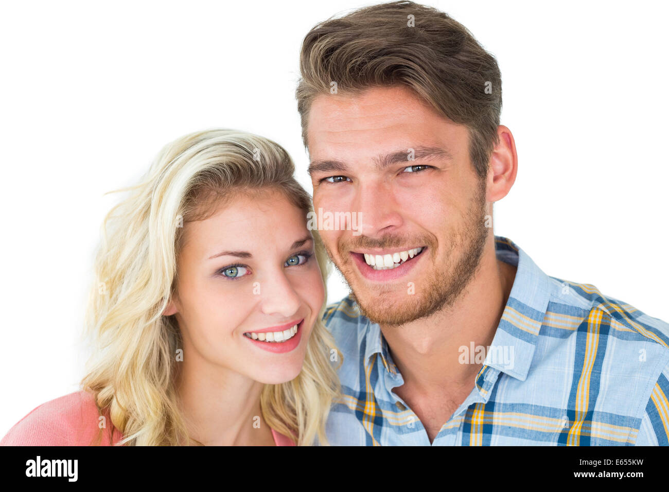 Attractive young couple smiling at camera Stock Photo - Alamy