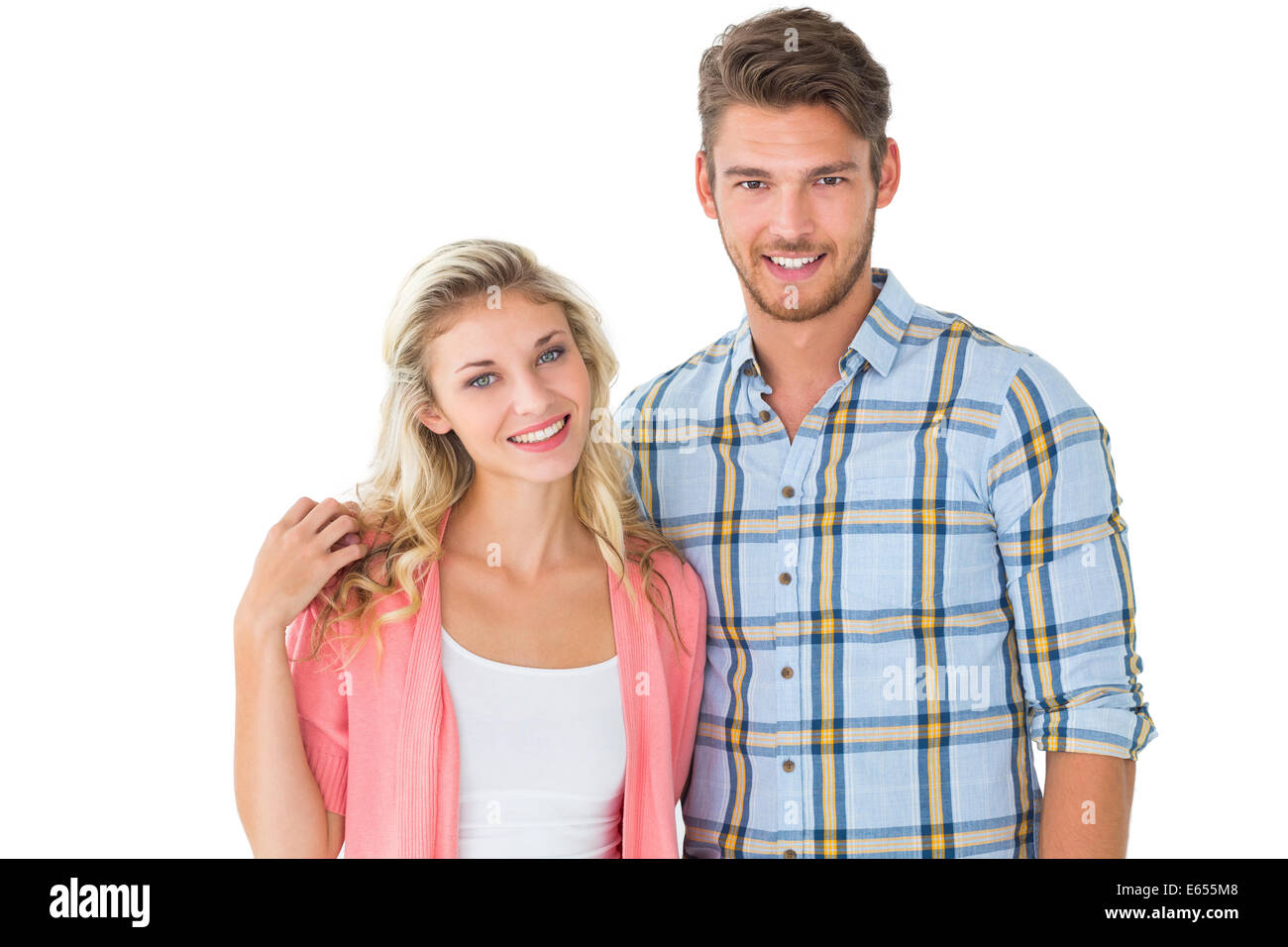 Attractive young couple smiling at camera Stock Photo - Alamy