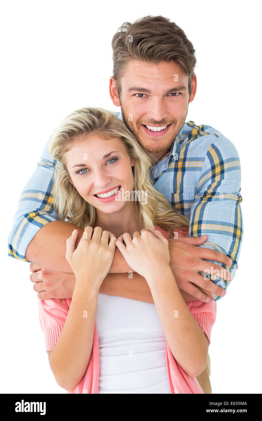 Attractive young couple smiling at camera Stock Photo - Alamy