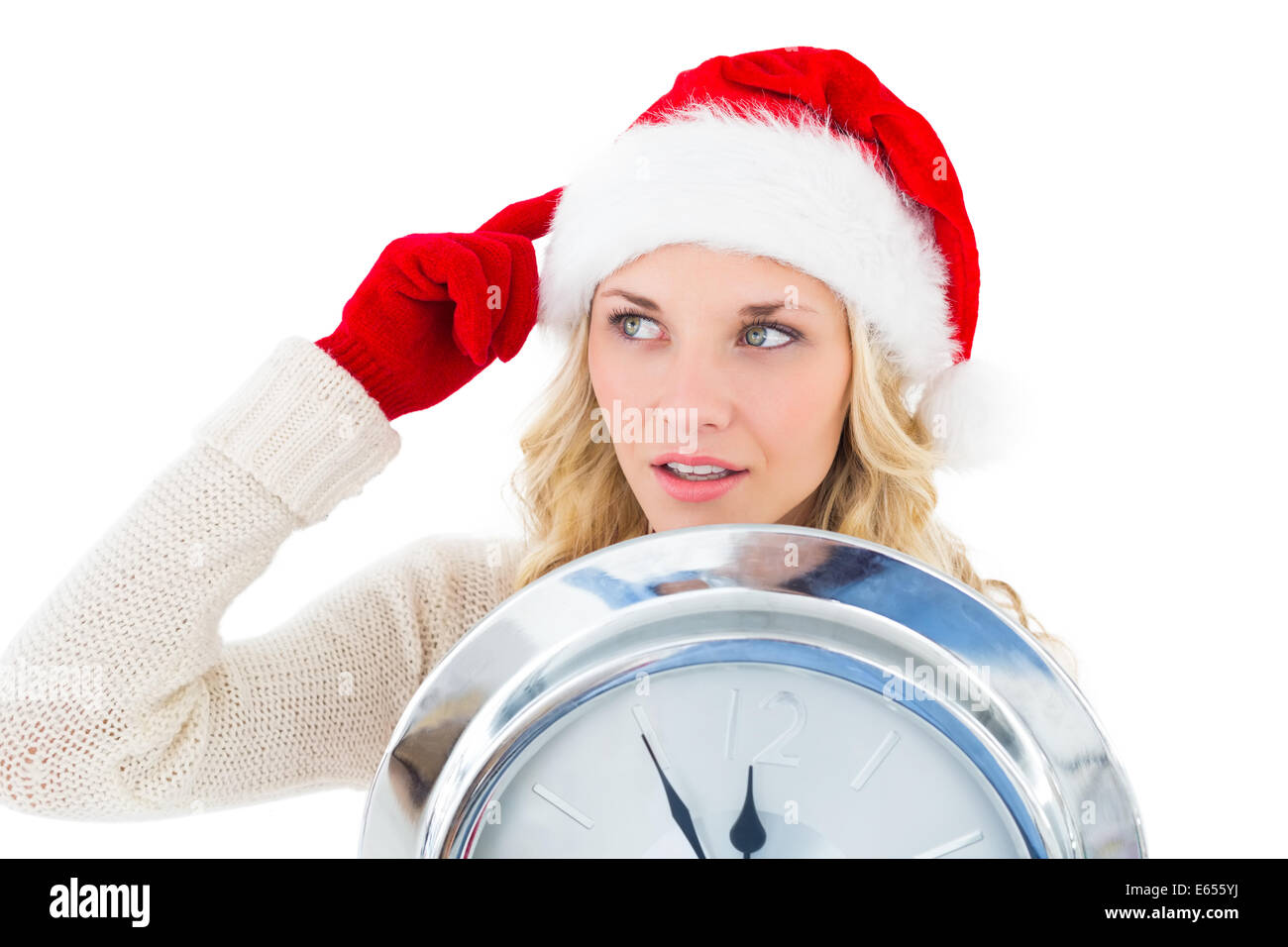 Festive blonde holding large clock Stock Photo