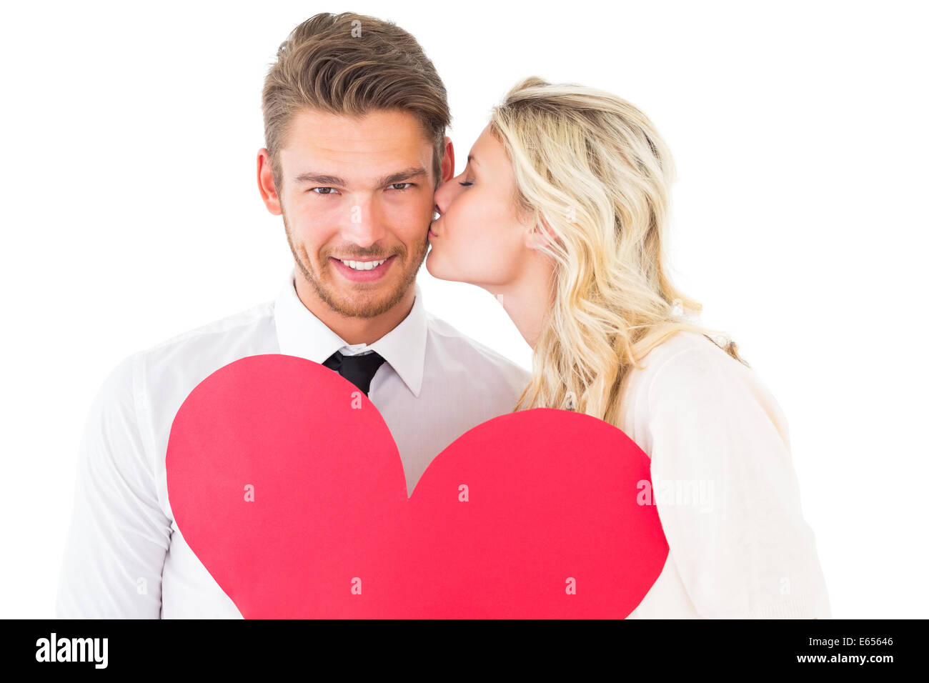 Attractive young couple holding red heart Stock Photo - Alamy