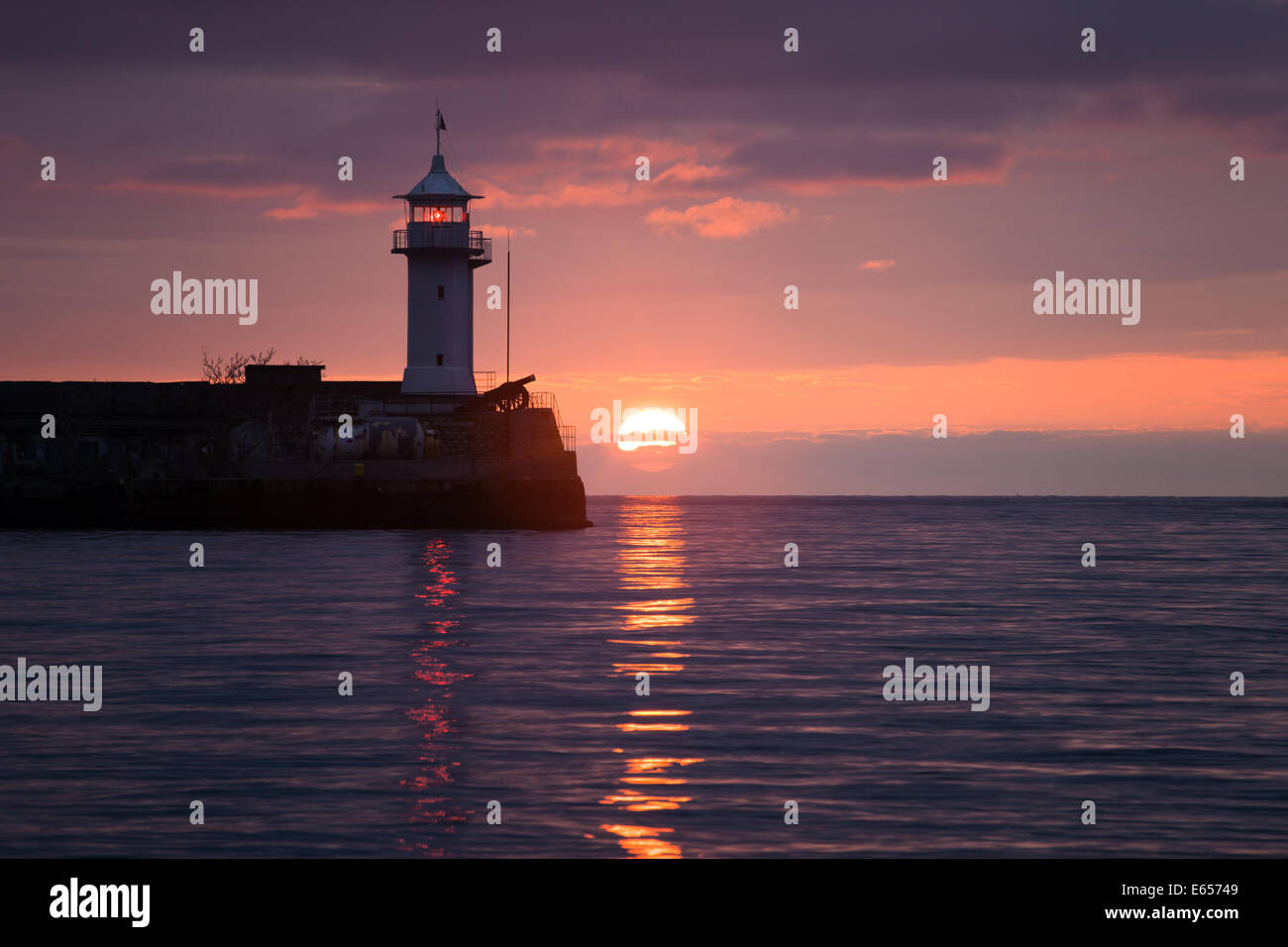 Lighthouse on sunrise. Yalta, Crimea, Ukraine Stock Photo Alamy