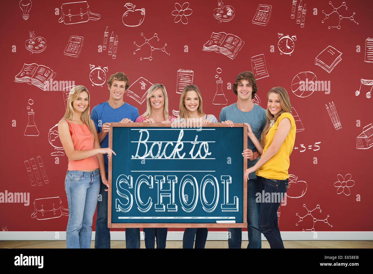 A group of people holding blackboard with message on wooden board Stock Photo