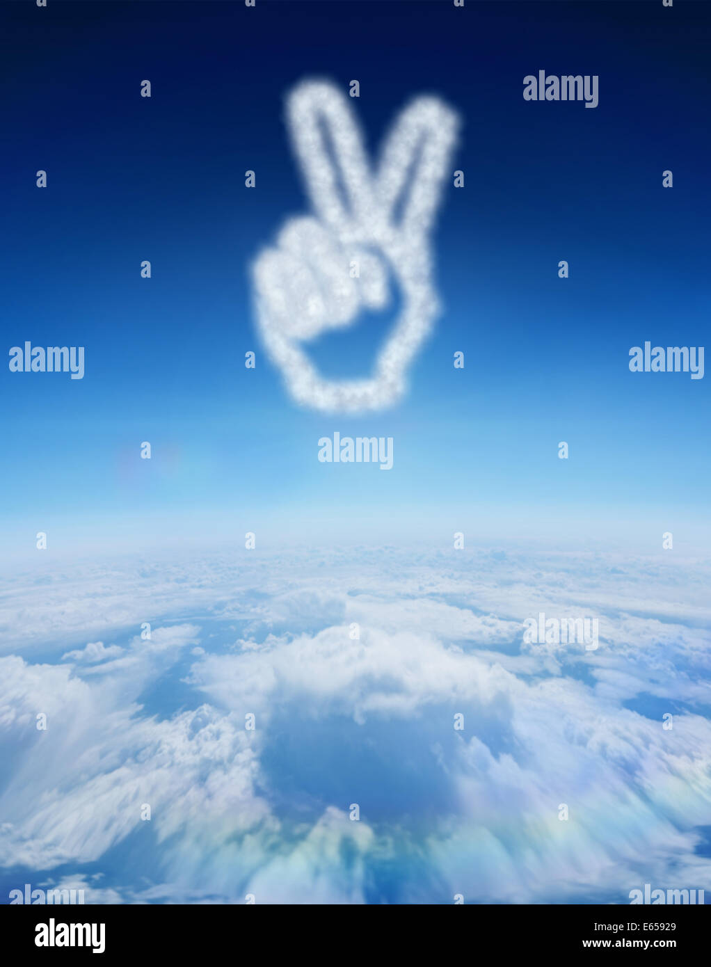 Composite image of cloud in shape of hand making peace sign Stock Photo