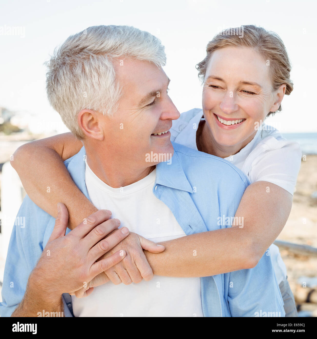 Casual couple having fun by the sea Stock Photo