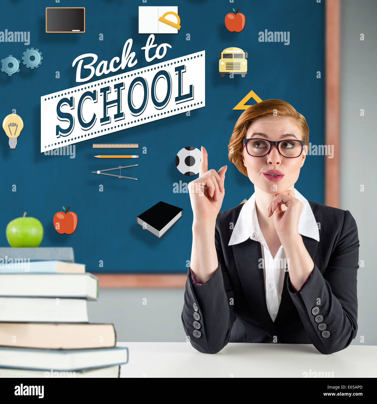 Composite image of thinking redhead teacher Stock Photo