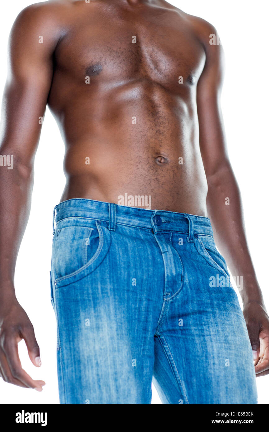 Mid section of shirtless muscular man Stock Photo