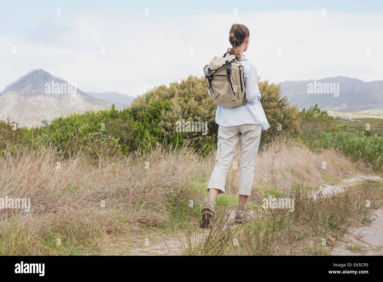Rear view of a hiking young woman Stock Photo - Alamy