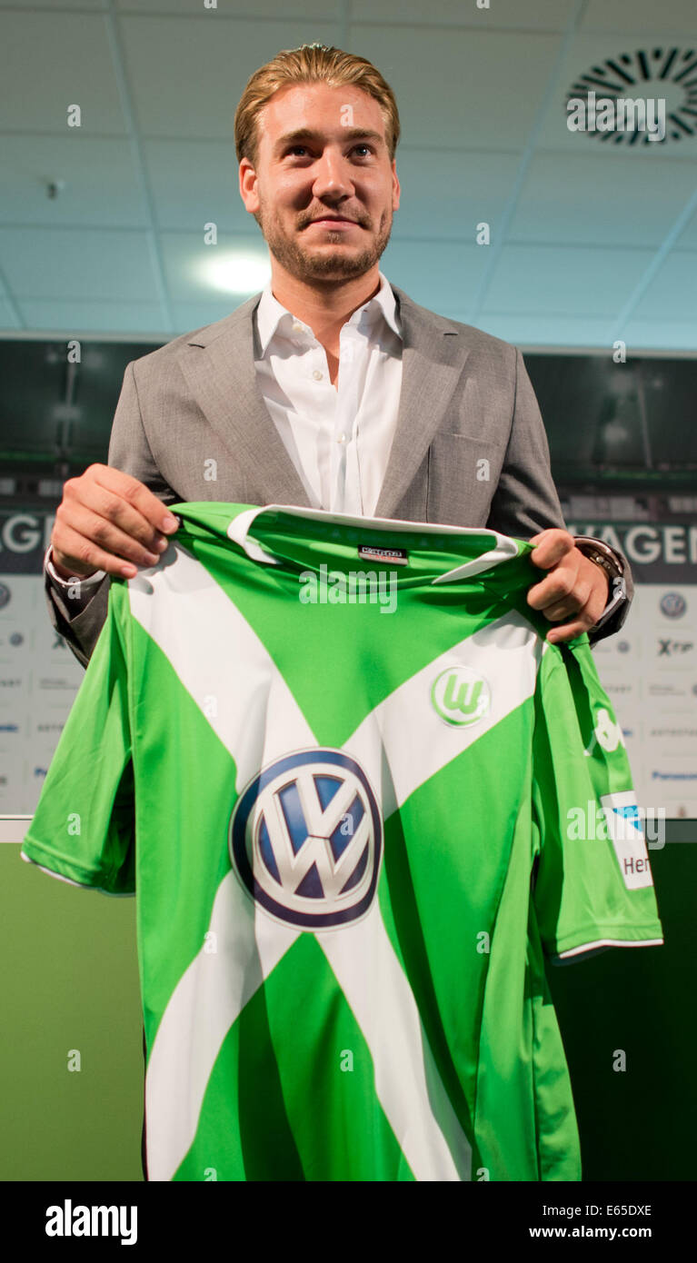 Wolfsburg, Germany. 15th Aug, 2014. New teammember of German Bundesliga  soccer club VFL Wolfsburg, Nicklas Bendtner from Denmark shows his jersey  during his introduction at Volkswagen Arena in Wolfsburg, Germany, 15 August