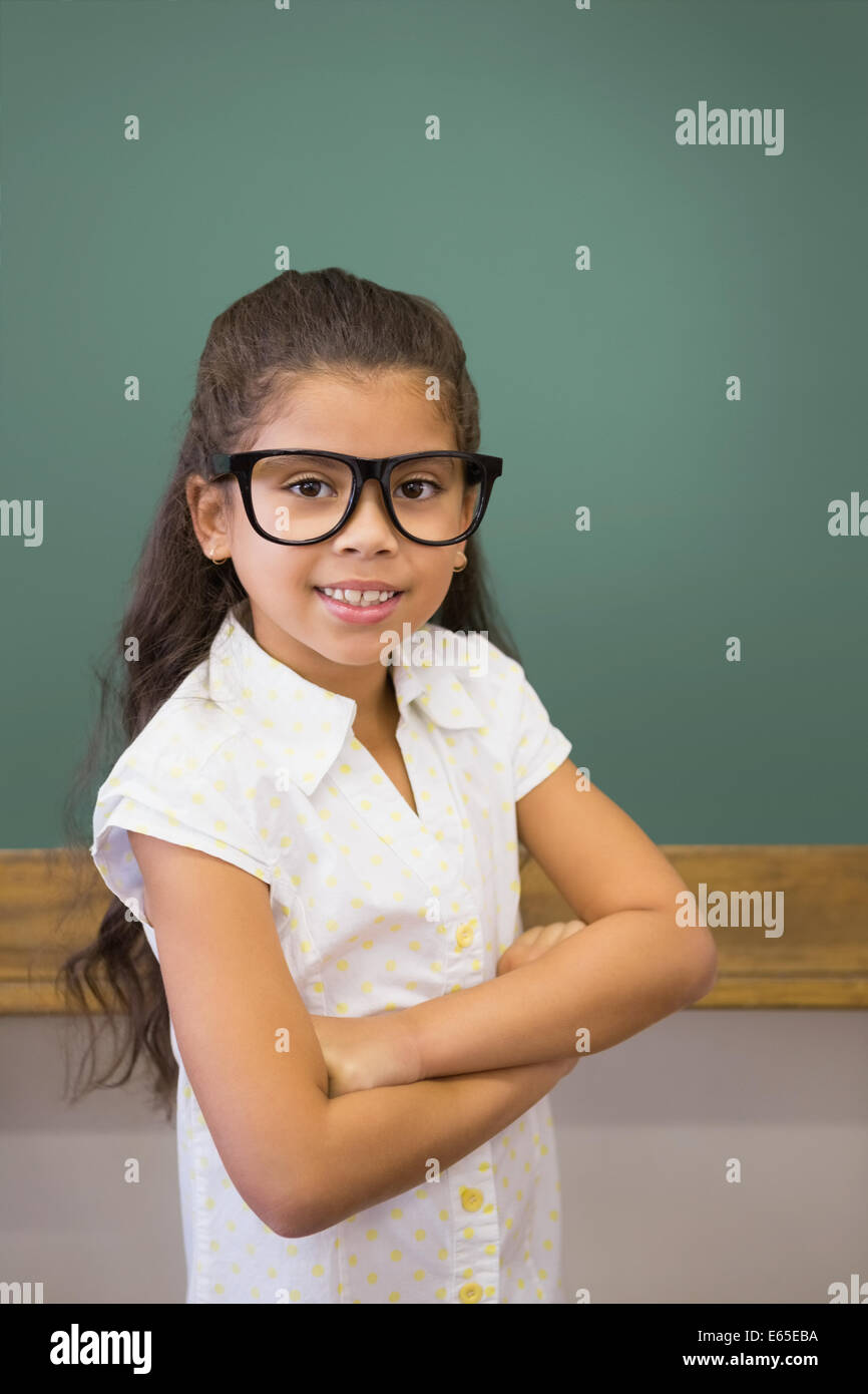 Cute pupil smiling at camera in classroom Stock Photo - Alamy