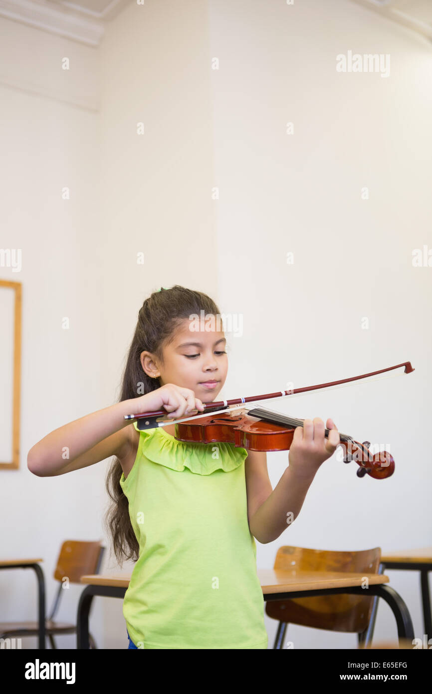 Cute pupil playing violin in classroom Stock Photo - Alamy