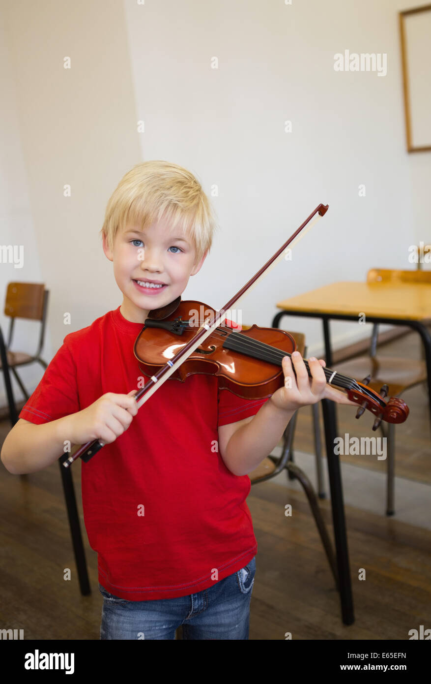 Cute pupil playing violin in classroom Stock Photo - Alamy