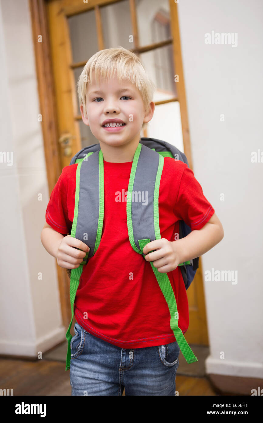 Cute pupil smiling at camera in classroom Stock Photo - Alamy