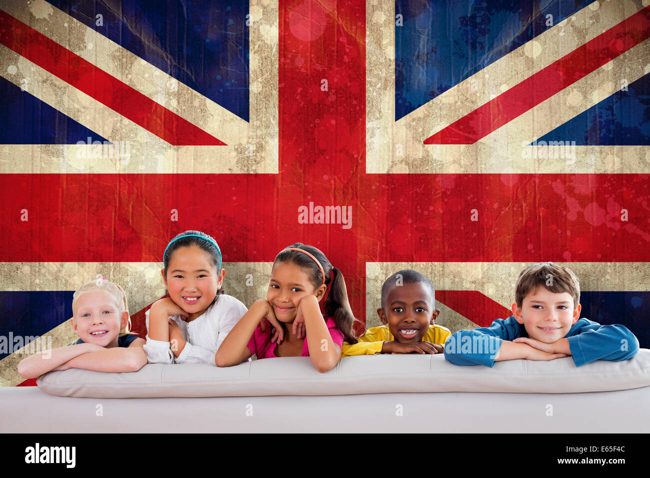 Composite image of cute pupils smiling at camera Stock Photo - Alamy