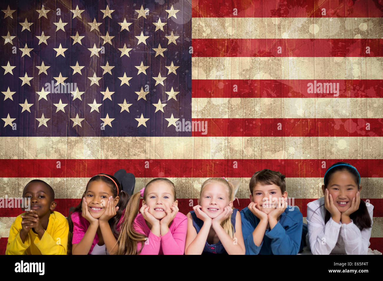 Composite image of cute pupils smiling at camera Stock Photo - Alamy