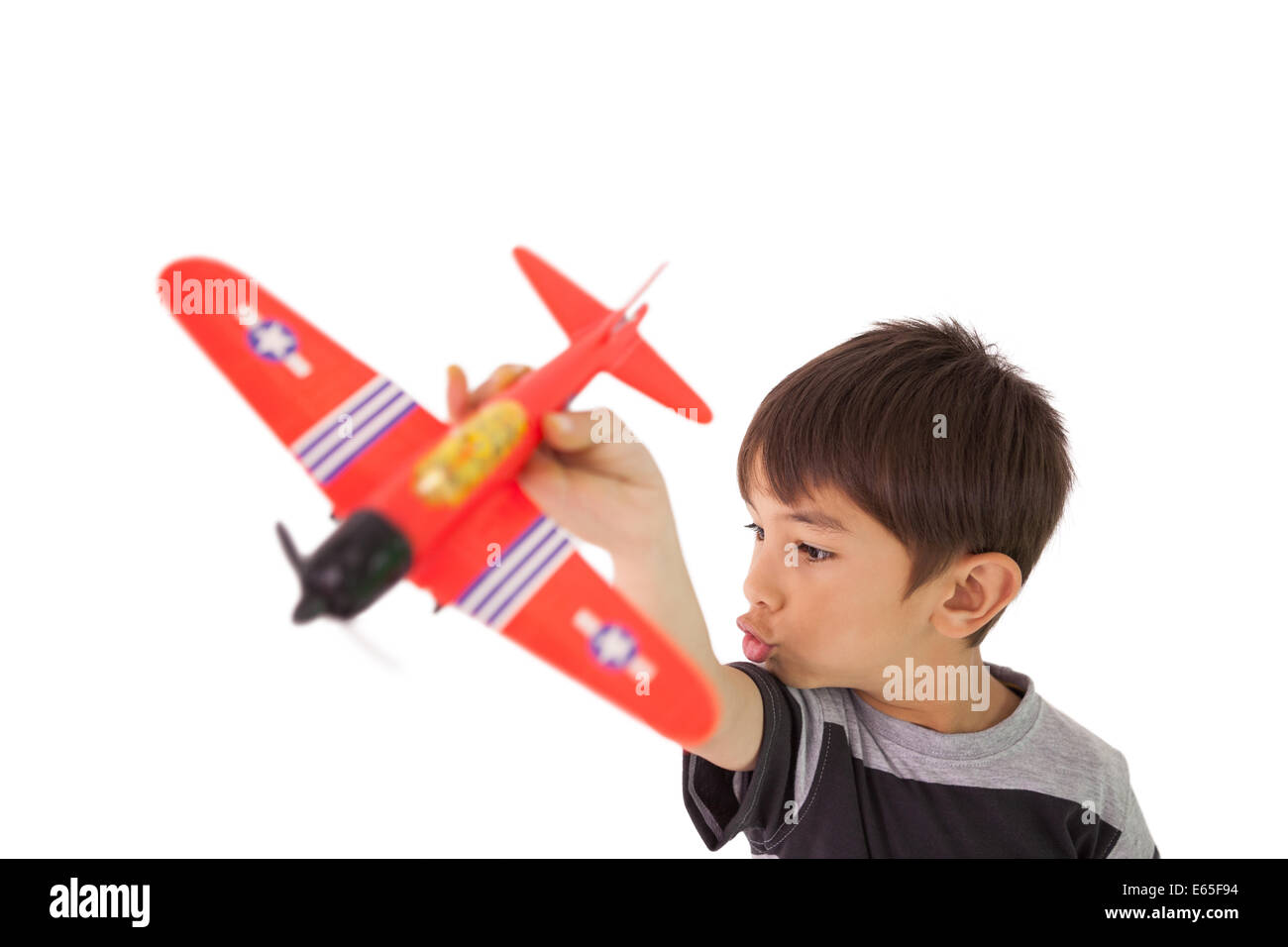 Happy little boy playing with toy airplane Stock Photo - Alamy