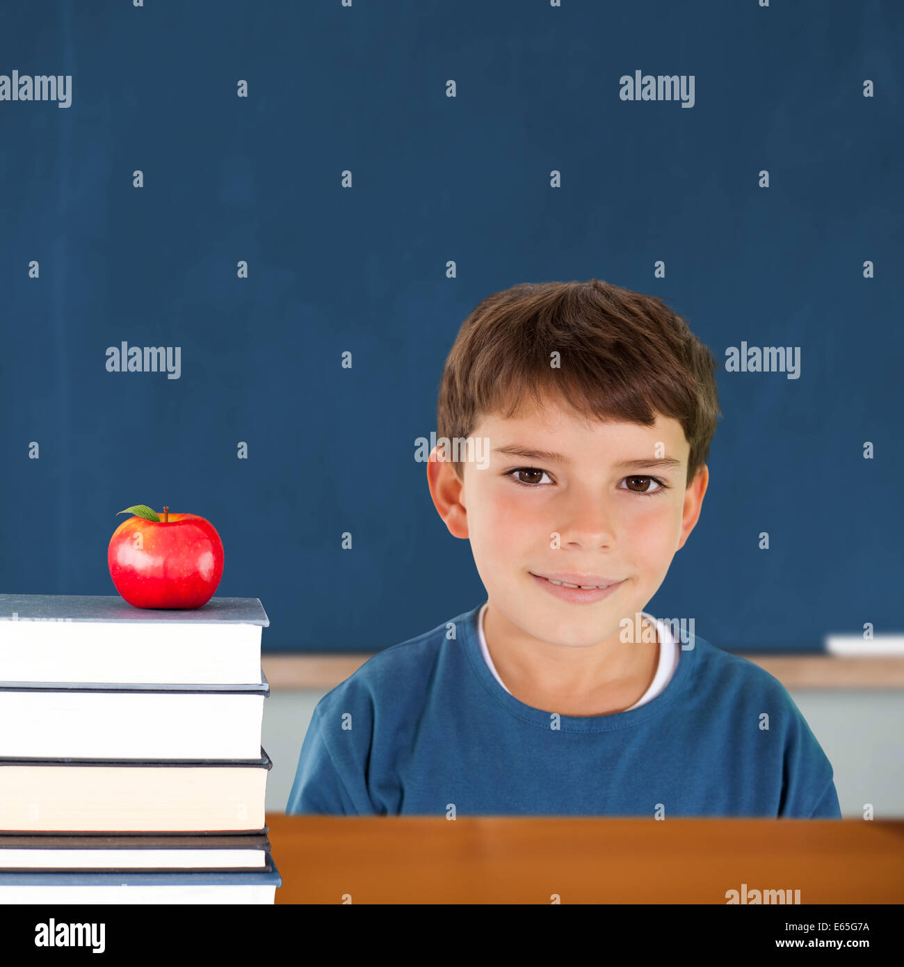 Composite image of cute boy smiling Stock Photo - Alamy