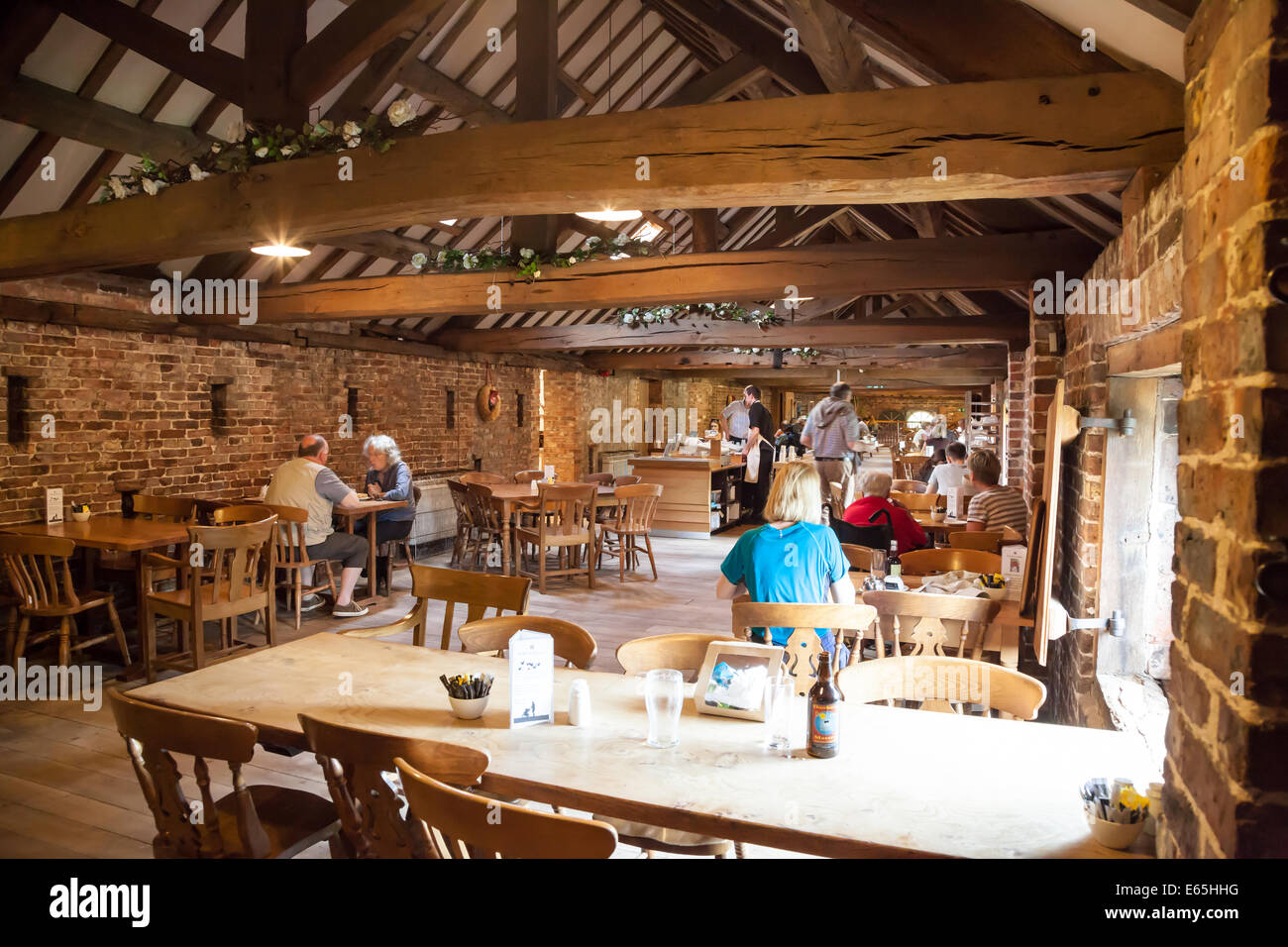 People eating and drinking in the cafe at Dunham Massey Hall Altrincham Greater Manchester Cheshire Stock Photo