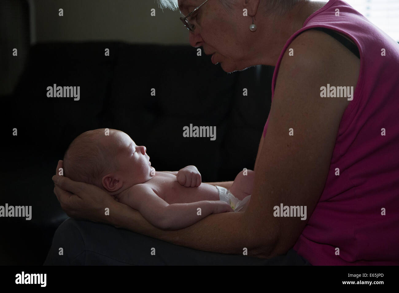 Denver, Colorado - Susan Newell holds her two-week-old grandson, Adam Hjermstad Jr. Stock Photo