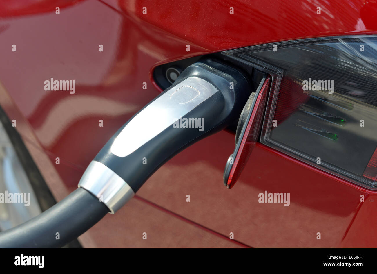 Tesla Model S electric super car charging at a Supercharger station