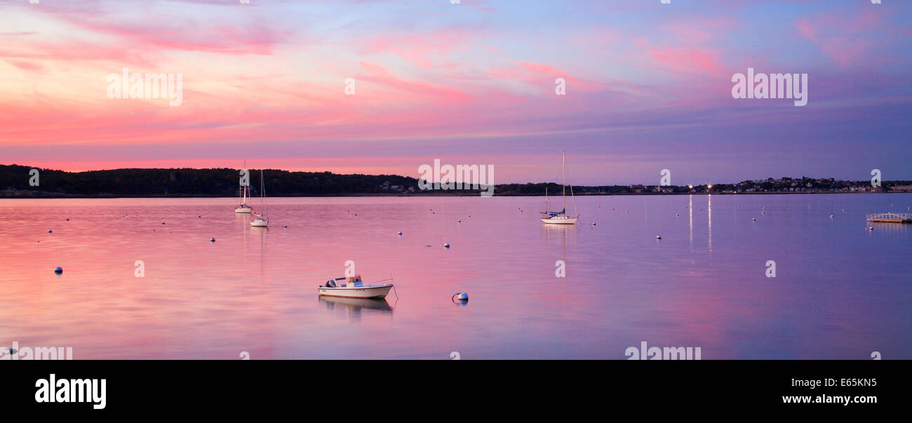 A Few Boats At Rest Just After Sunset On This Calm, Quiet Evening In Gloucester Bay, Gloucester, Massachusetts, USA Stock Photo