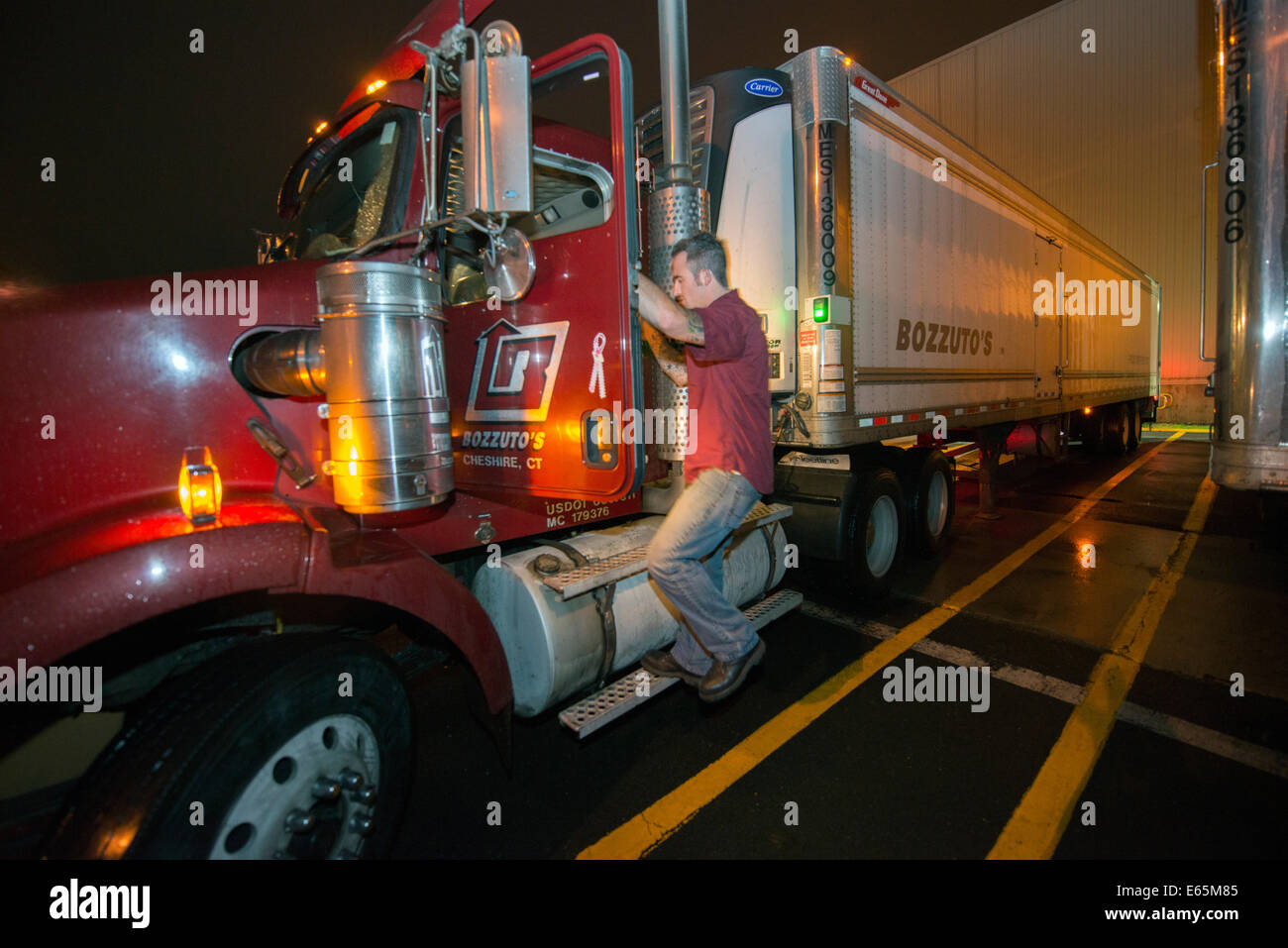 Driver Kyle Chapman, driver for Bozzuto's, the largest distributor of food in Connecticut, up early to drive to Brooklyn. Stock Photo