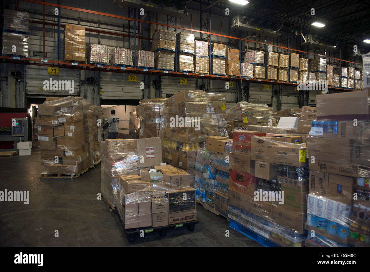 Refrigerated area in giant warehouse of food distributor Bozzuto's.  150 trucks supply IGA and other grocery stores. Stock Photo