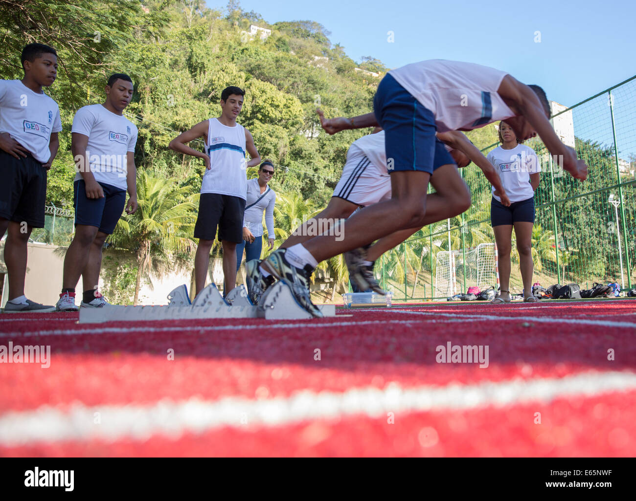 Rio de Janeiro, Brazil. 8th Aug, 2014. Students of Brazil's first sports high school, Ginasio Experimental Olimpico (GEO), are practicing on the racetrack of their school in Rio de Janeiro, Brazil, 8 August 2014. The 2016 summer olympics are going to be carried out in Rio de Janeiro. Photo: Michael Kappeler/dpa/Alamy Live News Stock Photo
