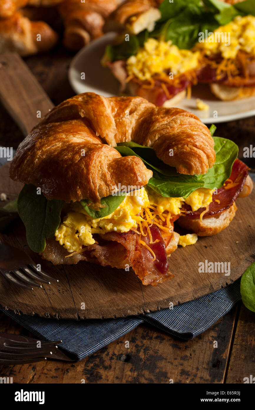 Ham and Cheese Egg Breakfast Sandwich on a Croissant Stock Photo
