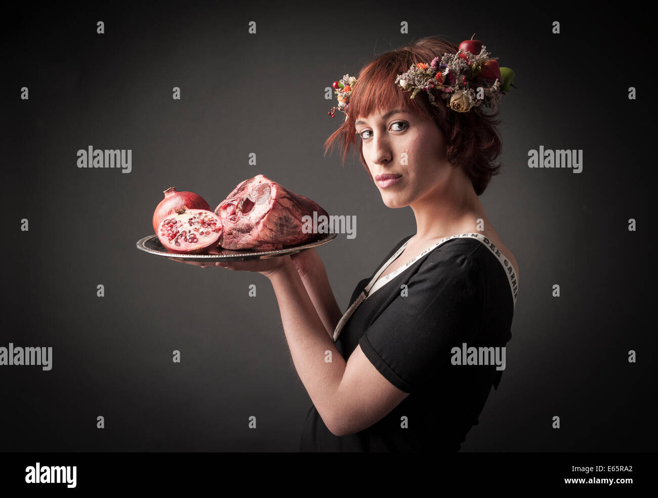 maid serving raw food Stock Photo